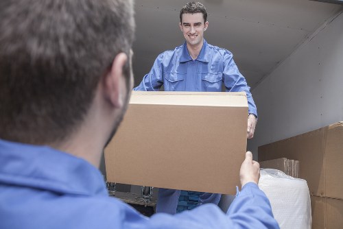 Professional movers loading a van for a Stepney home move