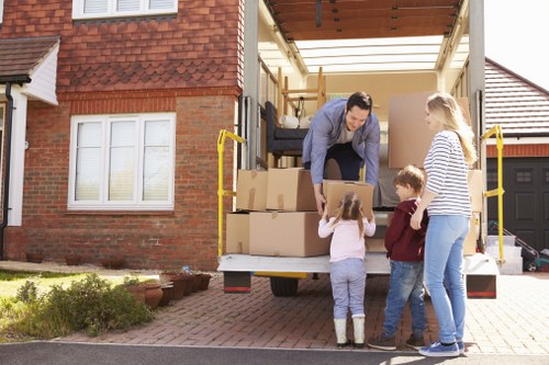 Local Stepney furniture removal service preparing bulky furniture for transport