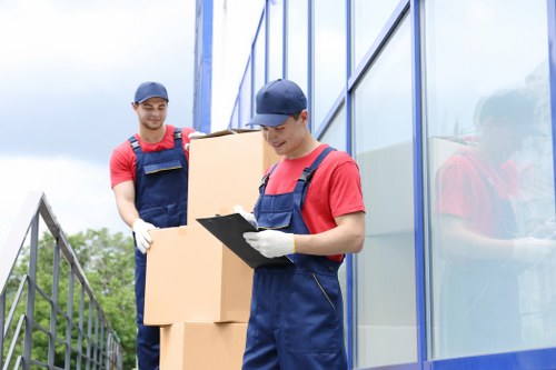 Man and van service loading boxes in Stepney street