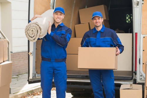 Professional movers handling office equipment during a Stepney relocation