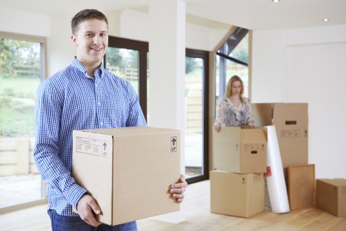 Organised home move in Stepney with packed boxes and removal truck
