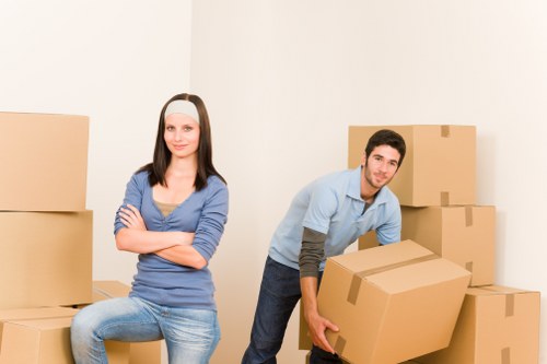 Local Stepney removals team handling packed boxes
