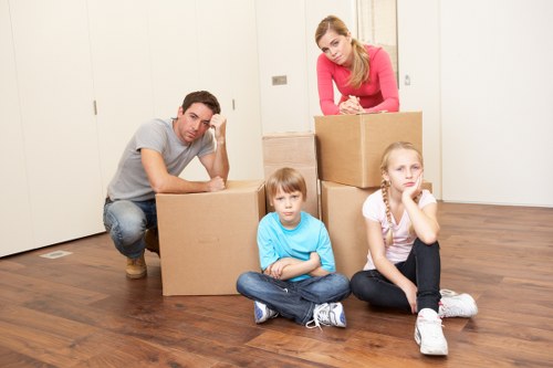 Workers handling furniture carefully in a property