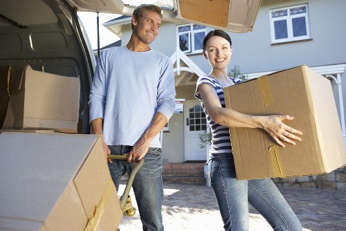 Movers handling furniture during flat removals in Stepney